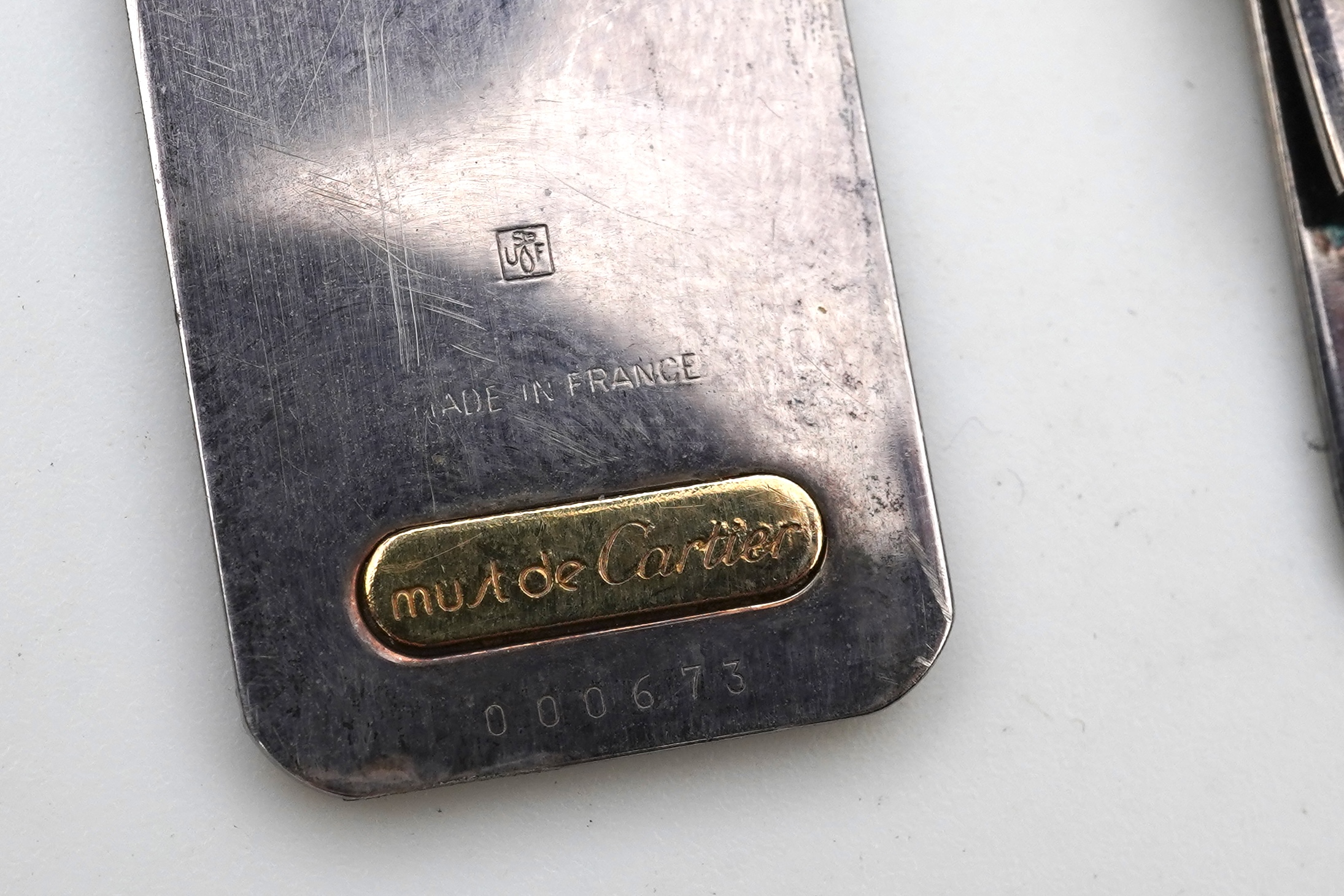 Cartier, two 'Must de Cartier' money clips